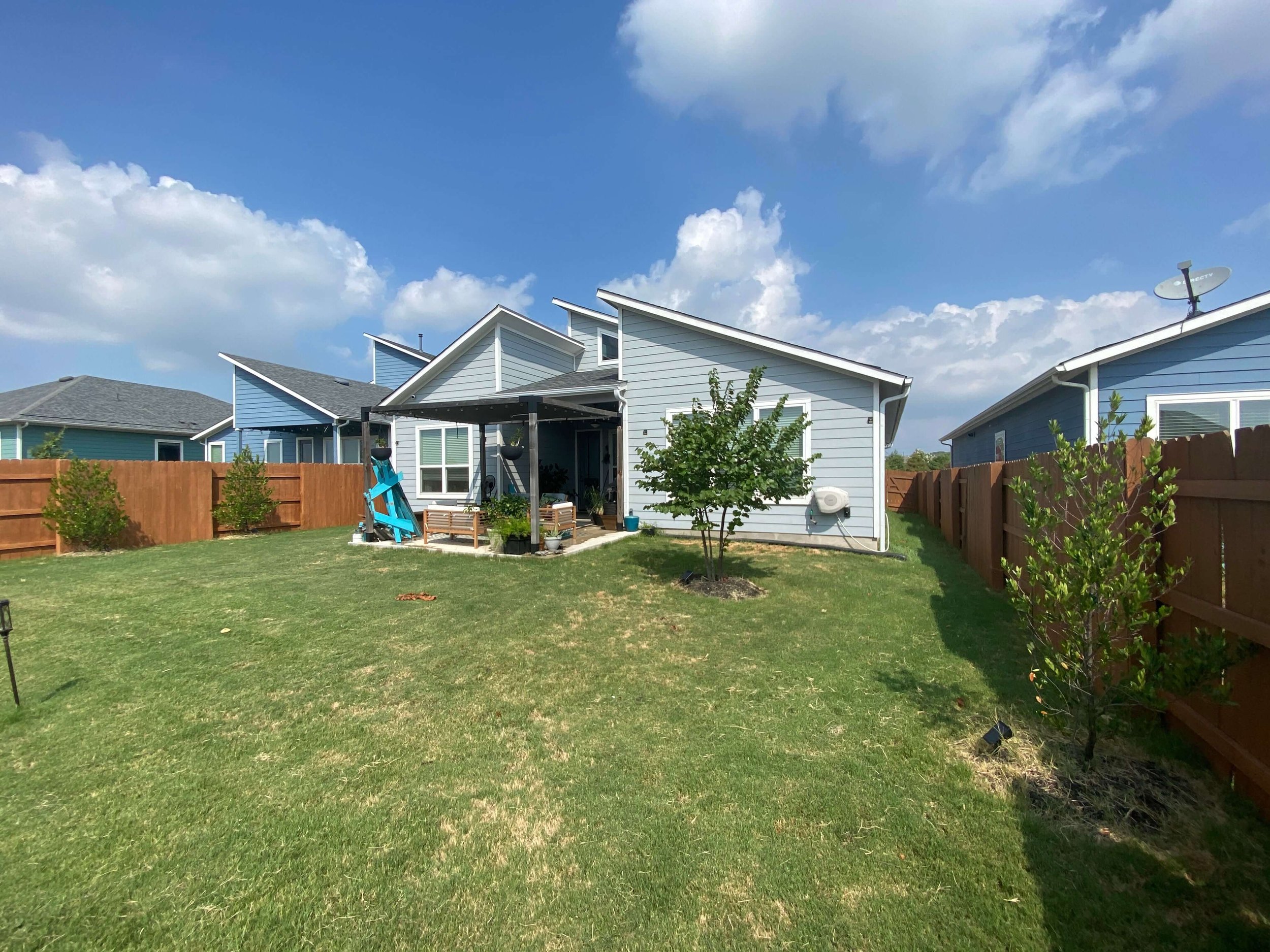  Wall-to-wall grass created high demands for both water and maintenance in the couple’s existing backyard. 