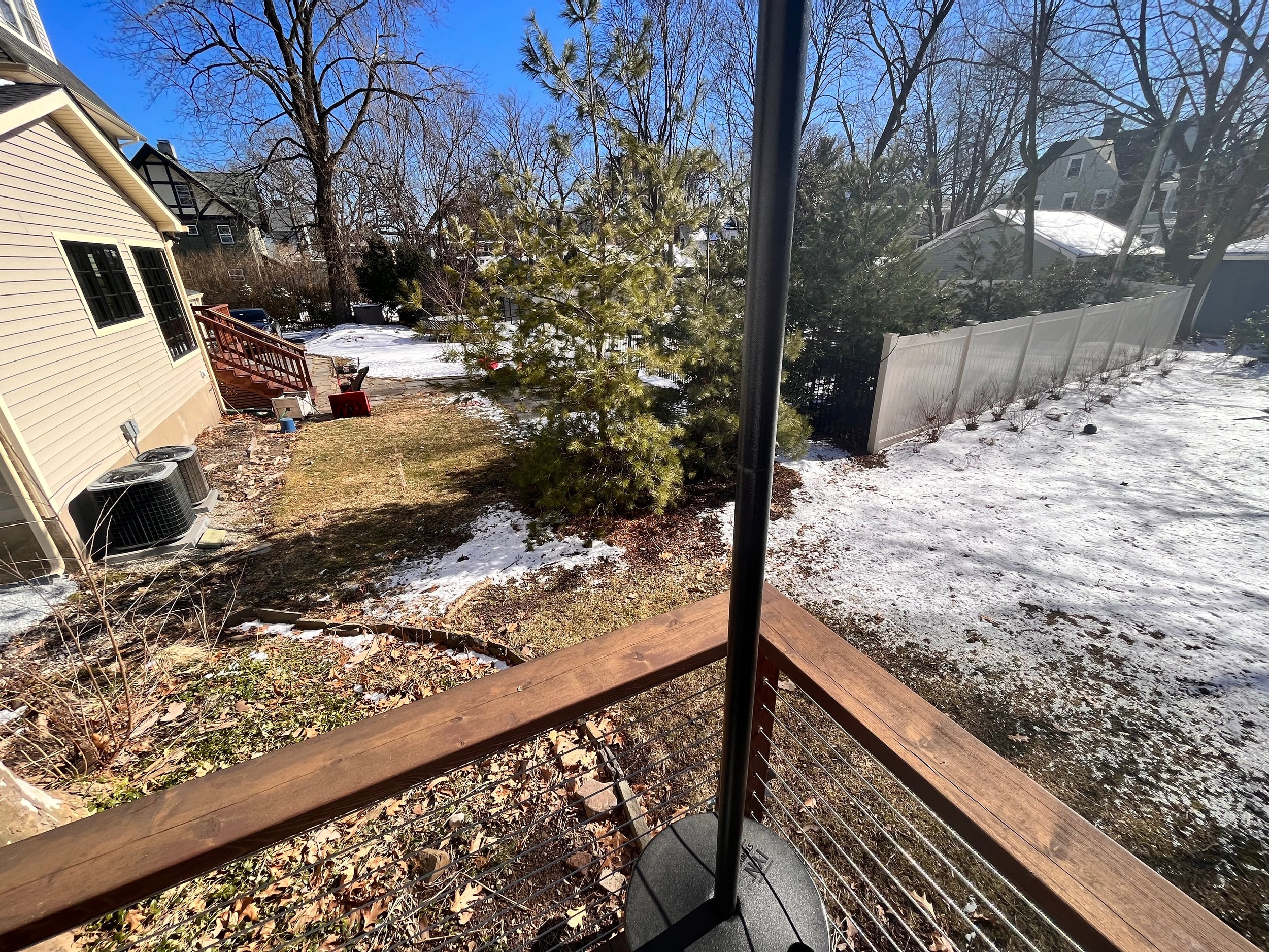 view from back deck toward neighbor's yard to the west with no privacy barrier