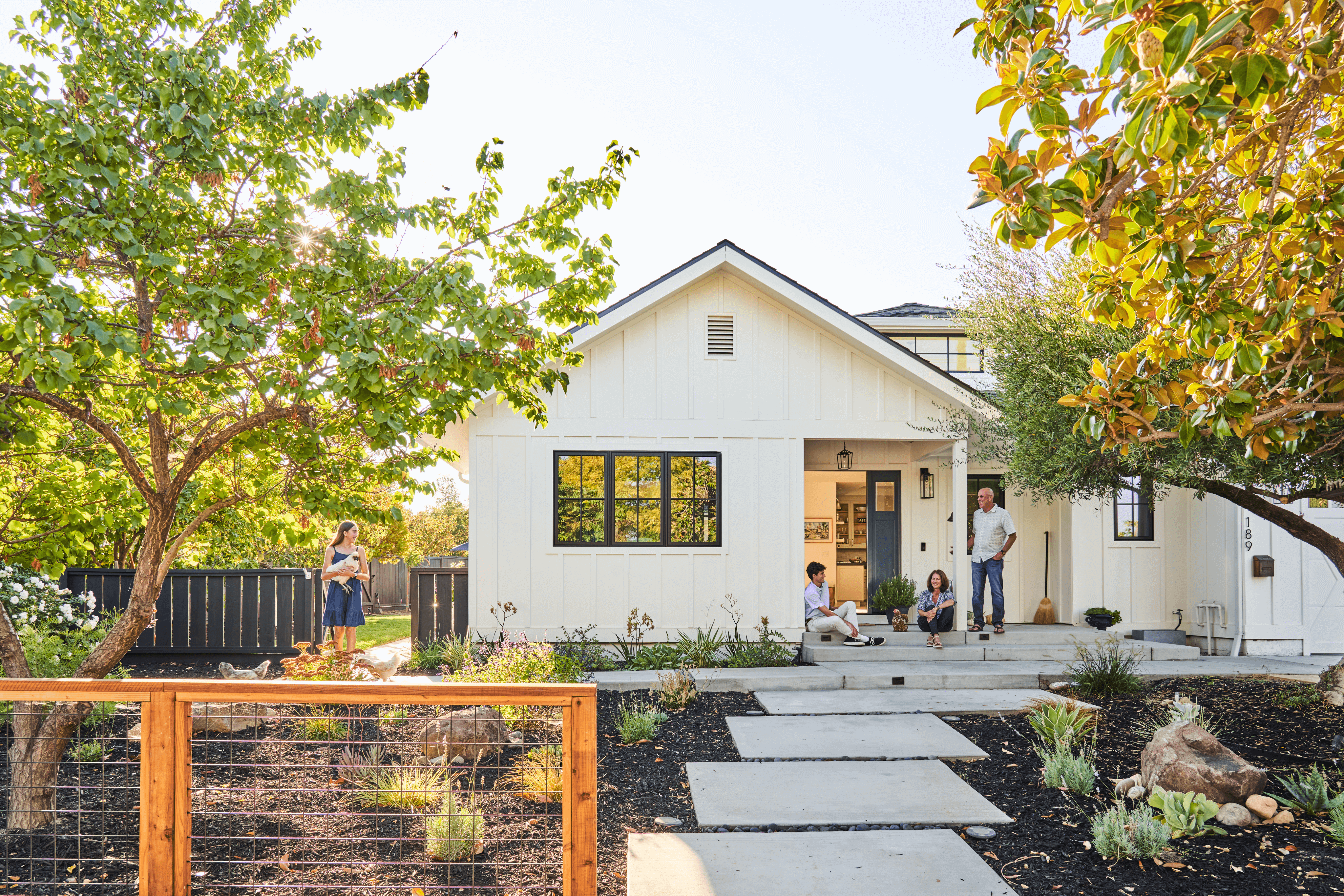 a grass-free front yard with a staggered paver walkway, native plants, and mulch a grass-free front yard with a staggered paver walkway, native plants, and mulch